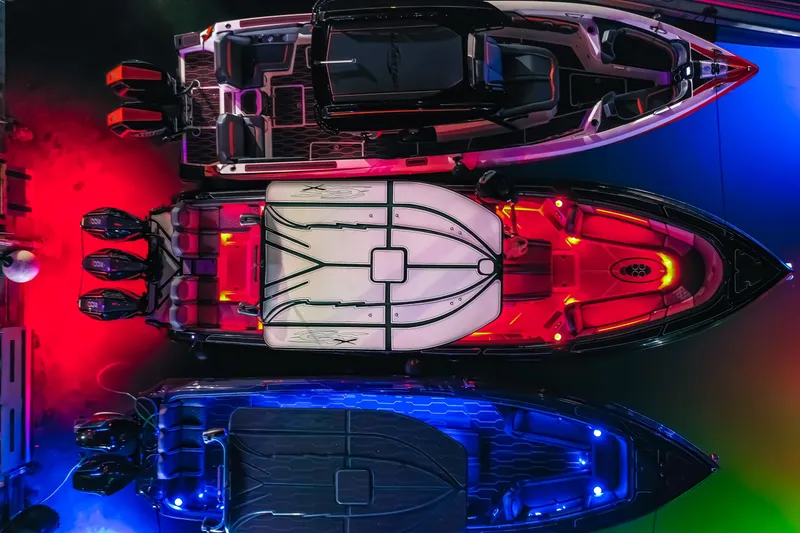 Slide: The Image of 2025 Glasstream 36 boat with vibrant red and blue LED lighting, top view. - 18