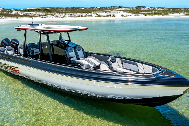 Slide: The Image of 2025 Glasstream 36 boat in clear turquoise water, showcasing sleek design and modern features. - 2