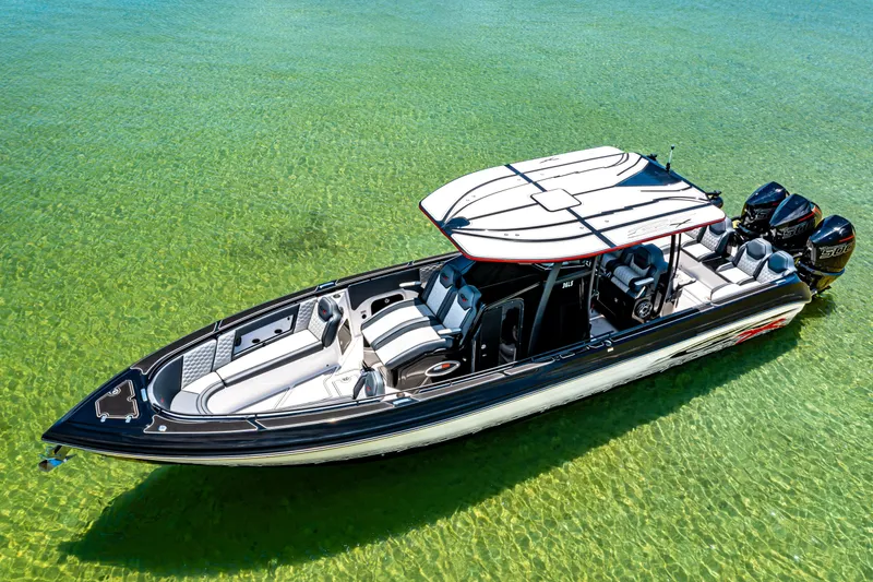 Slide: The Image of 2025 Glasstream 36 boat on clear water, showcasing sleek design and powerful engines. - 4