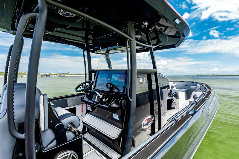 Slide: The Image of 2025 Glasstream 36 boat interior with advanced navigation system on calm water. - 6