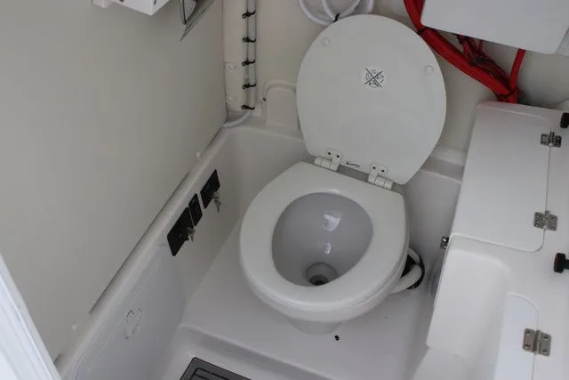 Slide: The Image of Interior of 2026 Tidewater LXF 272 yacht featuring a toilet. - 34