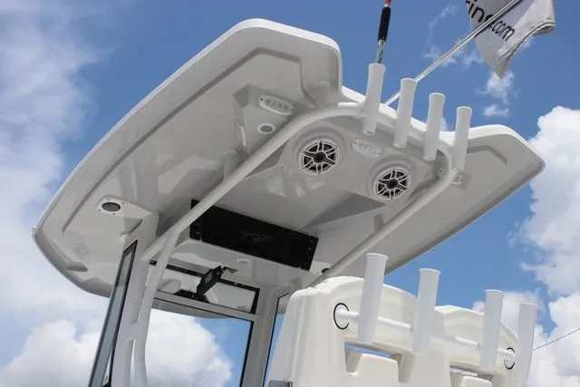 Slide: The Image of Tidewater LXF 272 2026 boat roof with speakers and rod holders. - 36