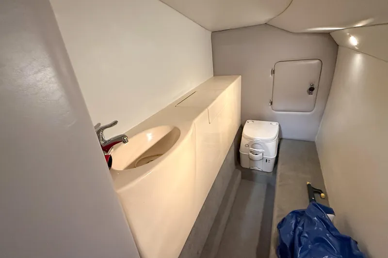 Slide: The Image of 2004 MTI 44 Pleasure Cat interior bathroom with sink and portable toilet. - 12