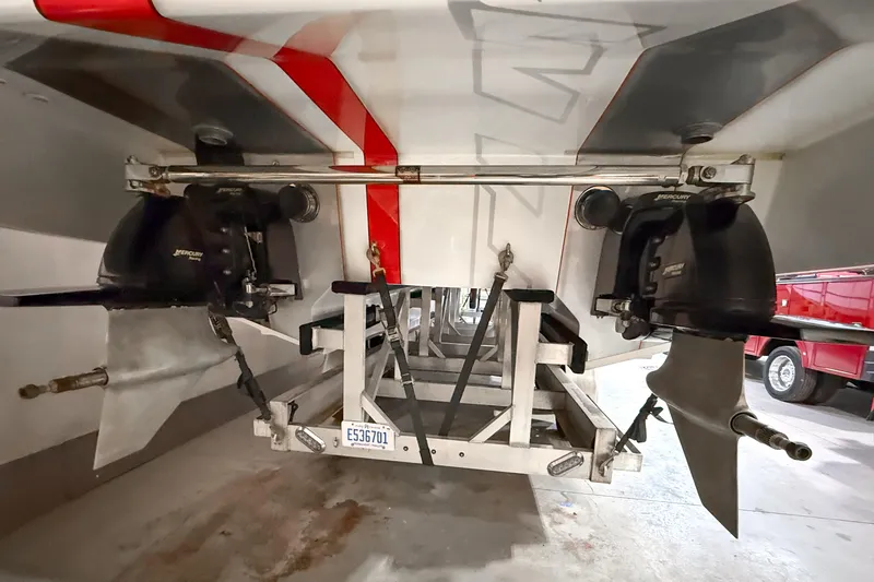 Slide: The Image of Rear view of 2004 MTI 44 Pleasure Cat with dual Mercury outboard motors. - 2