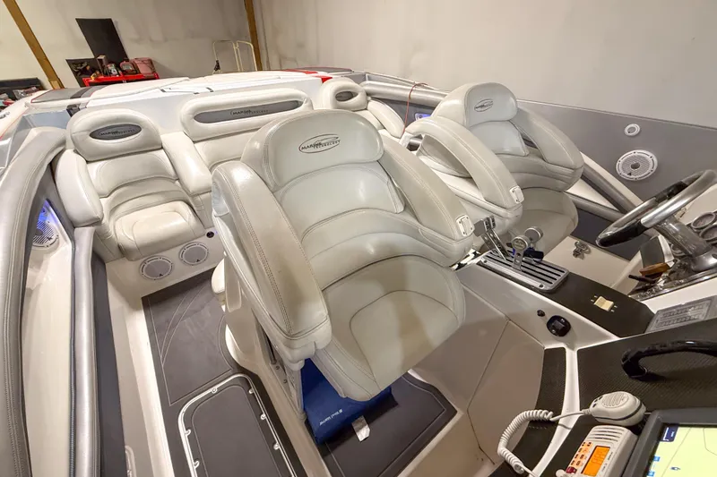Slide: The Image of Interior of a 2004 MTI 44 Pleasure Cat boat with luxurious seating and controls. - 4