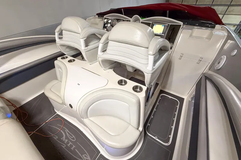 Slide: The Image of 2004 MTI 44 Pleasure Cat interior with white leather seats and modern dashboard. - 5