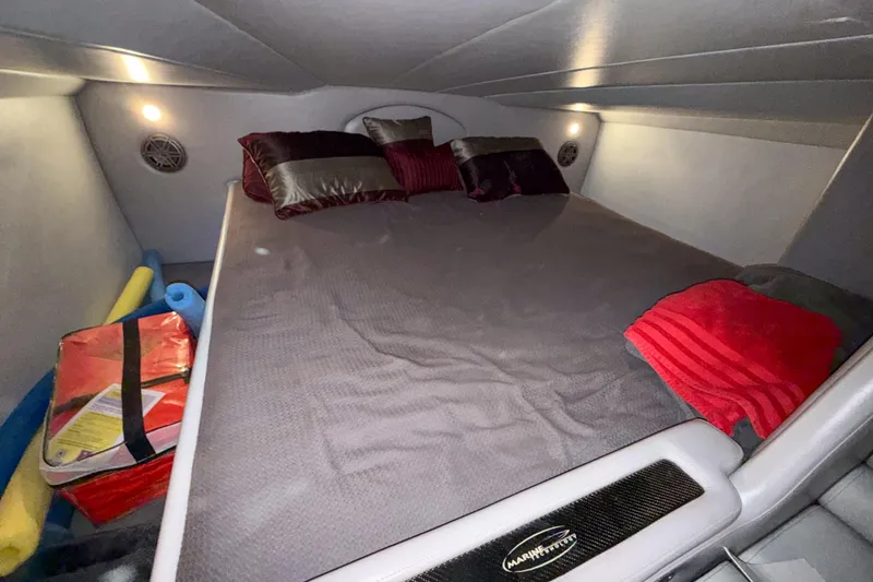 Slide: The Image of Cozy cabin interior of 2004 MTI 44 Pleasure Cat with bed and pillows. - 9