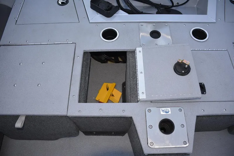 Slide: The Image of Manufacturer Provided Image: 2022 Smoker Craft Ultima 182 boat storage compartments and fishing rod holders. - 22