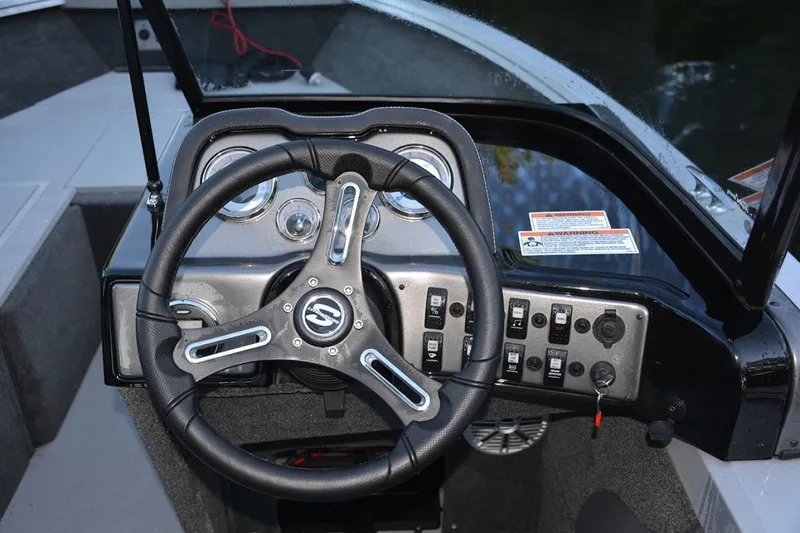 Slide: The Image of Manufacturer Provided Image: Steering console of 2022 Smoker Craft Ultima 182 boat with control panel and gauges. - 6