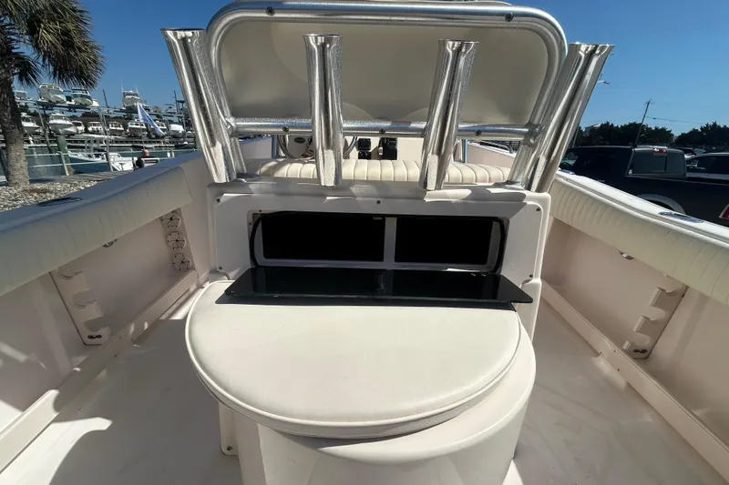 Slide: The Image of 2006 Grady-White Fisherman 222 boat interior with rod holders and seating. - 11