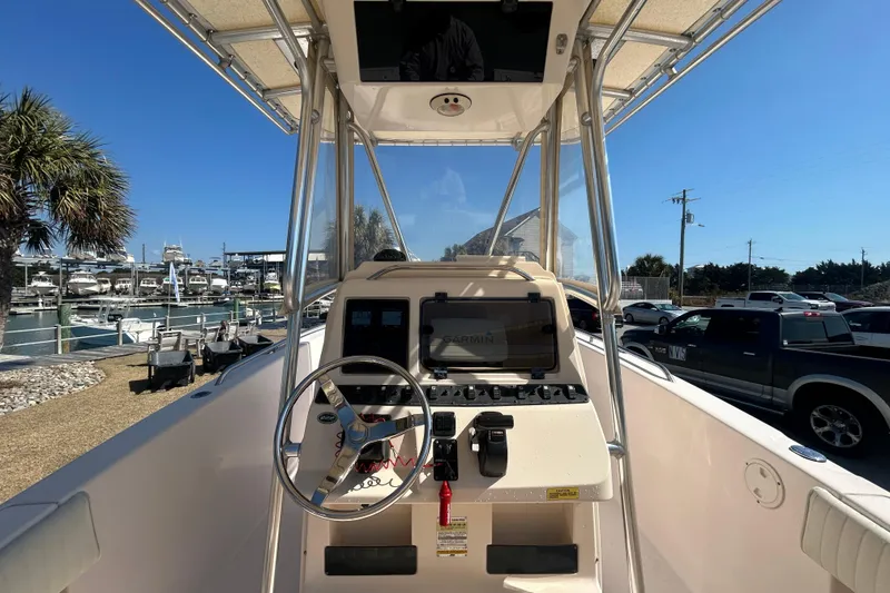 Slide: The Image of 2006 Grady-White Fisherman 222 boat console with steering wheel and navigation equipment. - 14