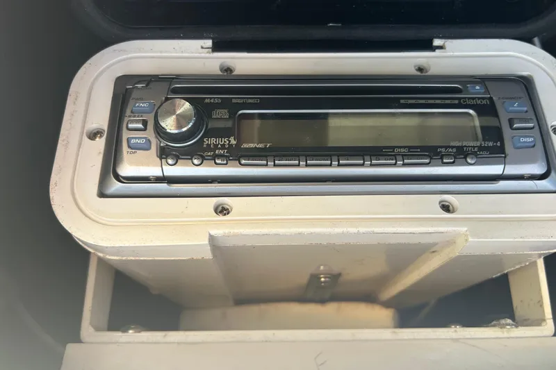 Slide: The Image of Clarion marine stereo system on 2006 Grady-White Fisherman 222 boat dashboard. - 17