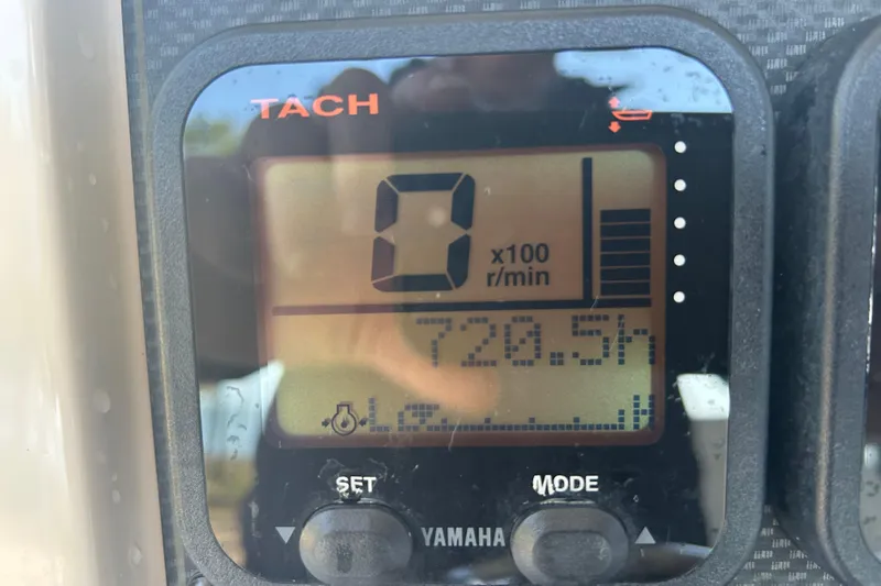 Slide: The Image of Yamaha tachometer display on 2006 Grady-White Fisherman 222, showing 720.5 hours. - 18
