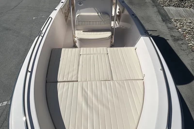 Slide: The Image of 2006 Grady-White Fisherman 222 boat interior with cushioned seating and sleek design. - 23