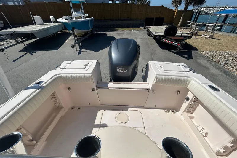 Slide: The Image of 2006 Grady-White Fisherman 222 boat interior with Yamaha 250 engine, docked outdoors. - 7