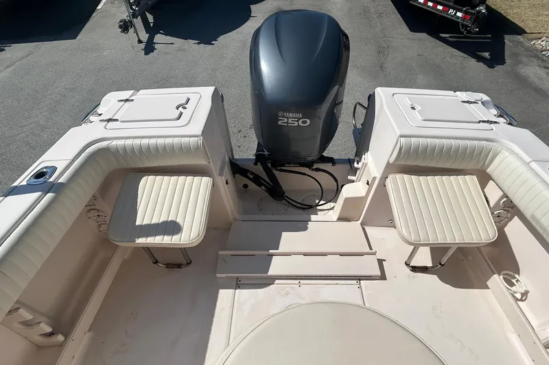 Slide: The Image of 2006 Grady-White Fisherman 222 boat interior with Yamaha 250 engine, featuring cushioned seating. - 8