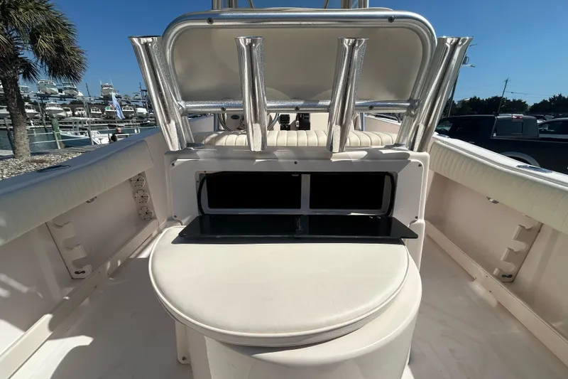 Slide: The Image of 2006 Grady-White Fisherman 222 boat interior with rod holders and seating. - 9