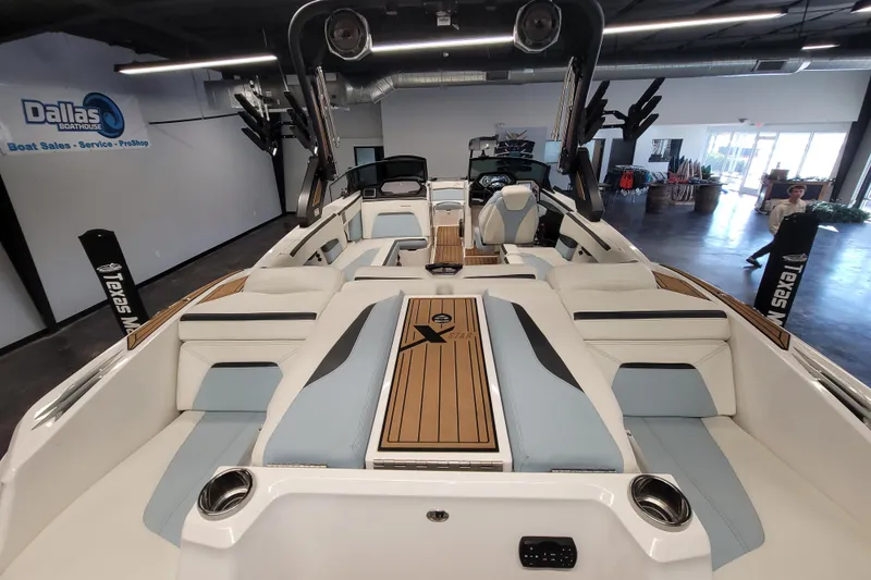 Slide: The Image of 2022 MasterCraft XStar S boat interior with luxurious seating and modern design at Dallas Boathouse. - 13