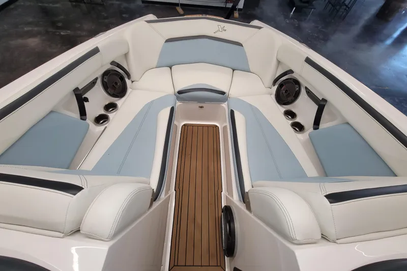Slide: The Image of 2022 MasterCraft XStar S boat interior with luxurious seating and modern design. - 23