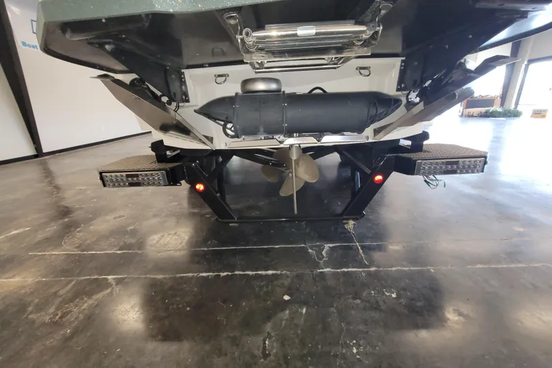 Slide: The Image of Rear view of 2022 MasterCraft XStar S boat showing propeller and platform details. - 7