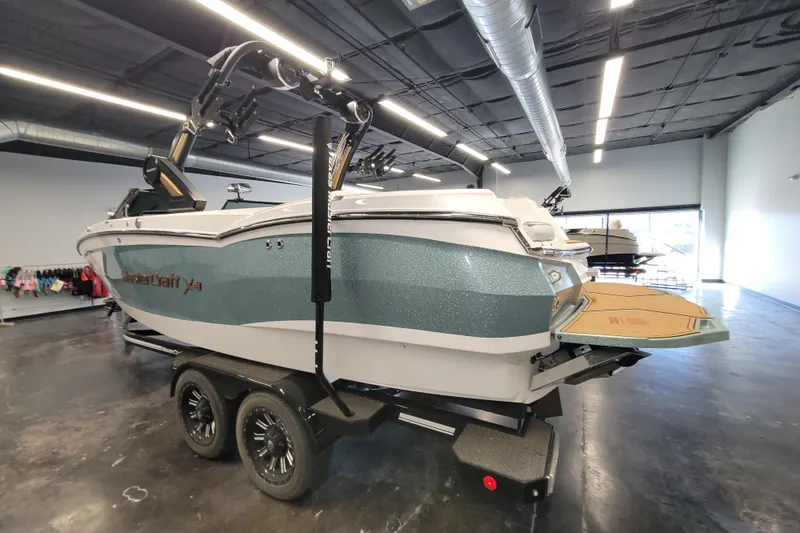 Slide: The Image of 2022 MasterCraft XStar S boat on trailer in showroom, rear view. - 8