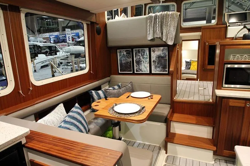 Slide: The Image of Interior of 2020 American Tug 362 with cozy dining area and modern decor. - 10