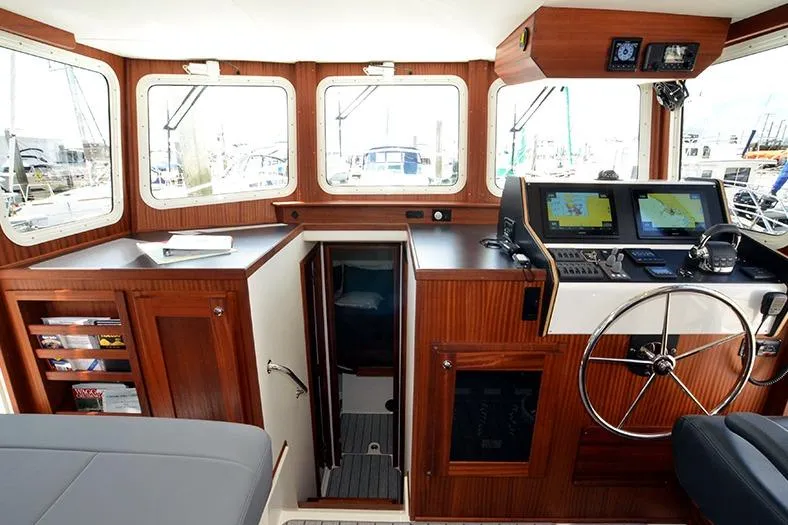 Slide: The Image of Interior of 2020 American Tug 362 with navigation equipment and wooden cabinetry. - 15