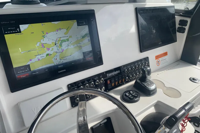 Slide: The Image of Control panel of 2018 Everglades 355 Center Console with Garmin navigation display. - 17
