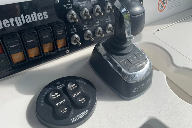Slide: The Image of Control panel of 2018 Everglades 355 Center Console with joystick and switches. - 19