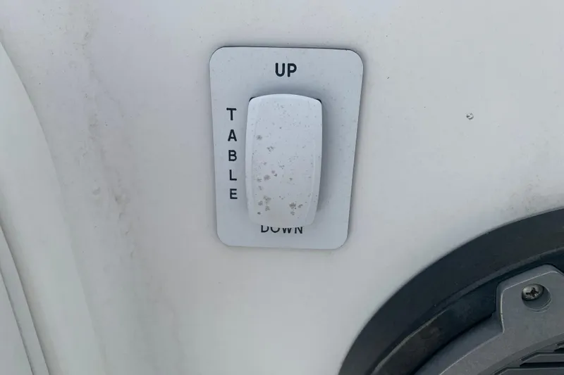 Slide: The Image of Switch for table adjustment on 2018 Everglades 355 Center Console boat. - 26