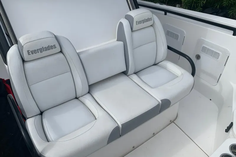 Slide: The Image of 2018 Everglades 355 Center Console boat seating, featuring white and gray cushioned seats. - 28