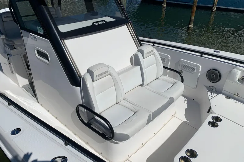 Slide: The Image of 2018 Everglades 355 Center Console boat interior with white seating and sleek design. - 3