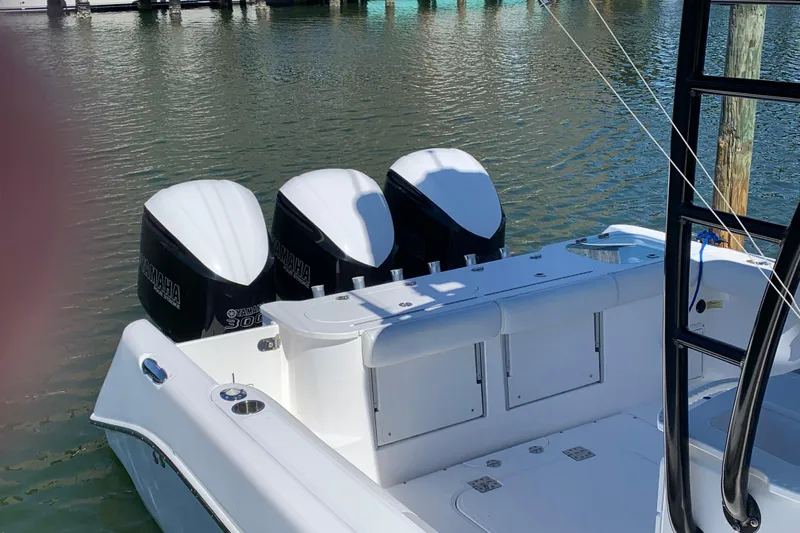 Slide: The Image of 2018 Everglades 355 Center Console boat with triple Yamaha 300 engines docked. - 4