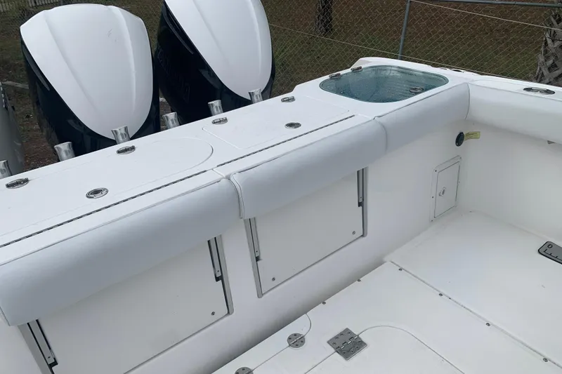 Slide: The Image of 2018 Everglades 355 Center Console boat interior with seating and storage compartments. - 8