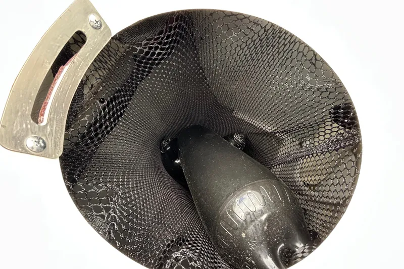 Slide: The Image of 2022 Crownline 270 XSS boat interior with open storage compartment and cushioned seating. - 102