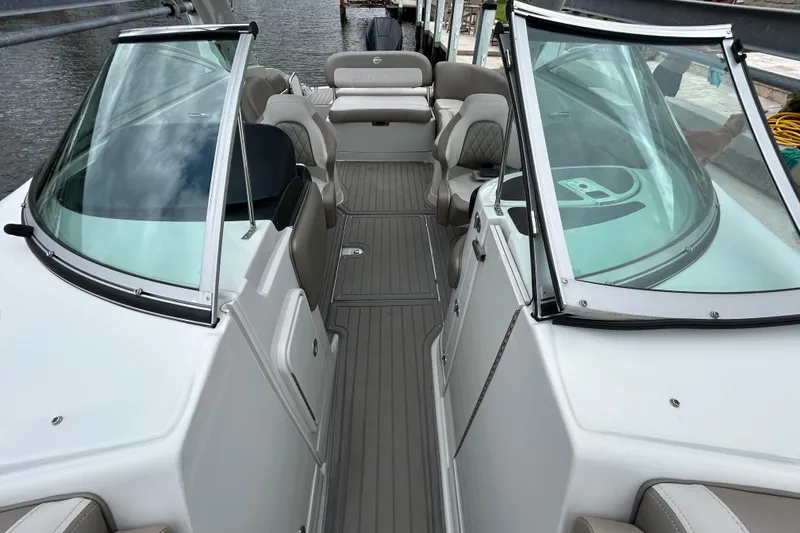 Slide: The Image of Storage compartment of 2022 Crownline 270 XSS boat, featuring a clean, spacious interior. - 103