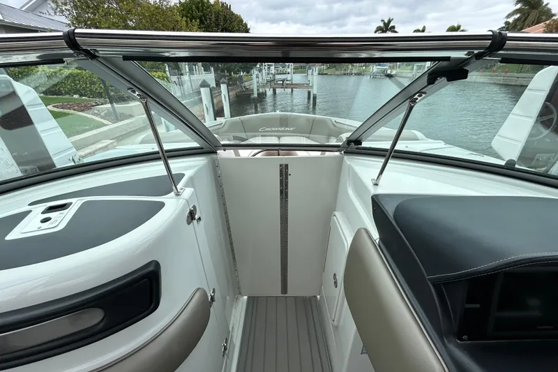 Slide: The Image of Anchor locker of 2022 Crownline 270 XSS boat with coiled rope and windlass. - 106