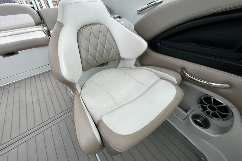 Slide: The Image of Crownline 270 XSS 2022 boat interior with cushioned seating and speaker detail. - 107