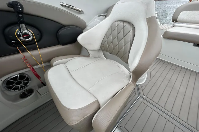 Slide: The Image of Storage compartment of 2022 Crownline 270 XSS boat, open and empty. - 109