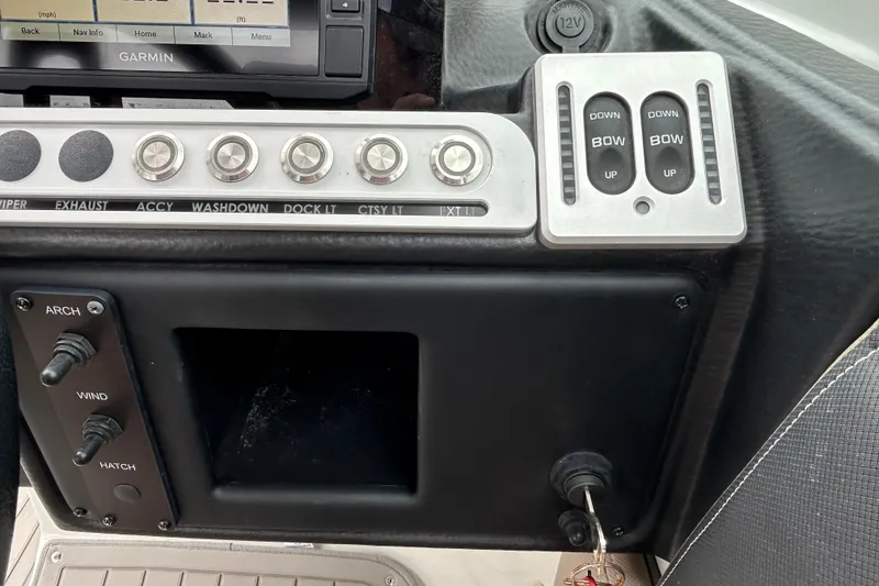 Slide: The Image of 2022 Crownline 270 XSS boat interior with seating and windshield view. - 115