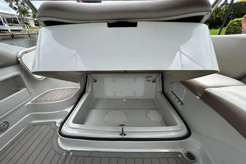 Slide: The Image of 2022 Crownline 270 XSS boat interior with plush seating and modern controls. - 118