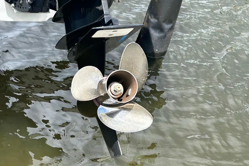 Slide: The Image of 2022 Crownline 270 XSS boat emblem on sleek white surface. - 14