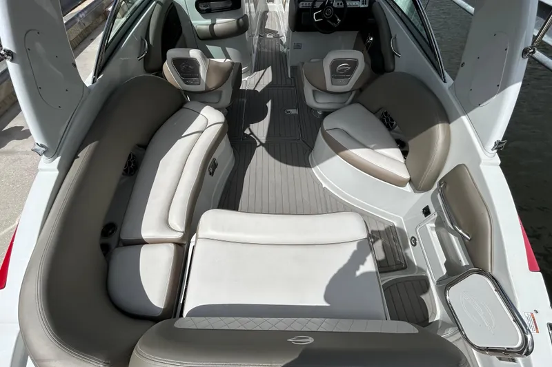 Slide: The Image of 2022 Crownline 270 XSS boat with black canopy, viewed from below. - 20