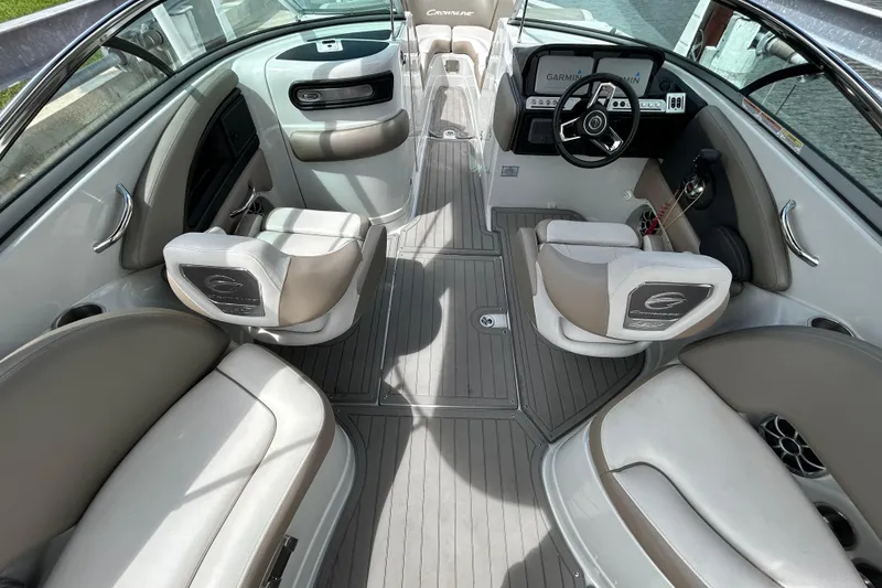 Slide: The Image of 2022 Crownline 270 XSS boat interior with modern seating and steering wheel. - 23