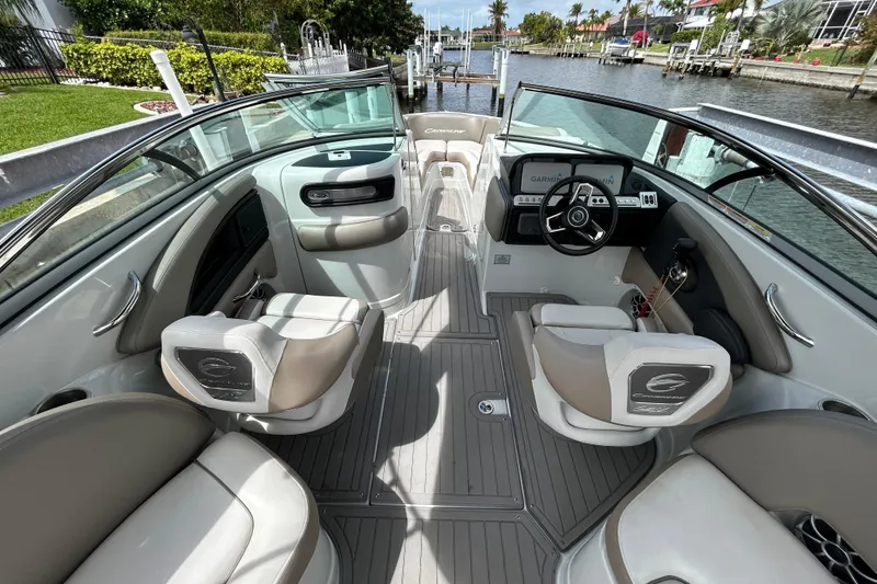 Slide: The Image of 2022 Crownline 270 XSS boat interior with sleek seating and modern dashboard. - 24