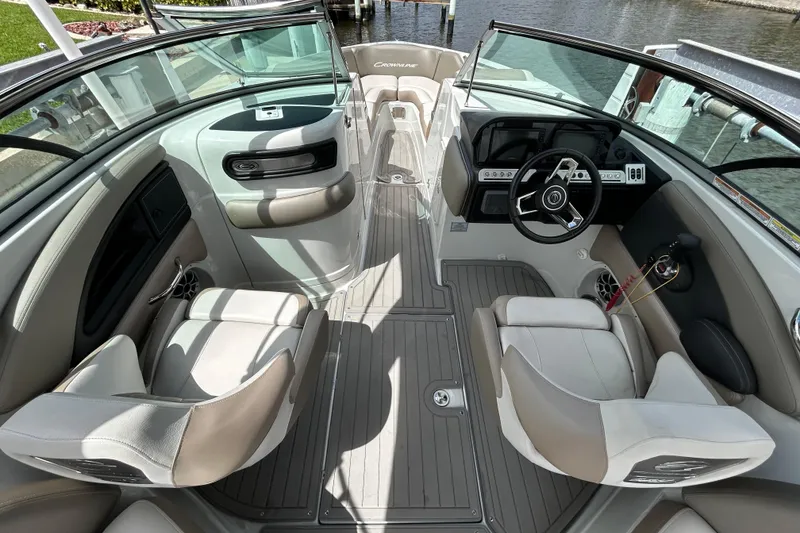 Slide: The Image of 2022 Crownline 270 XSS boat interior with modern dashboard and seating. - 25