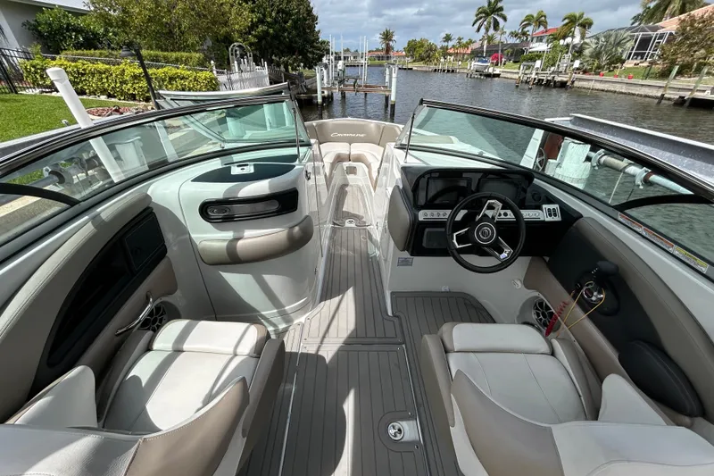 Slide: The Image of 2022 Crownline 270 XSS boat interior with sleek dashboard and comfortable seating. - 26