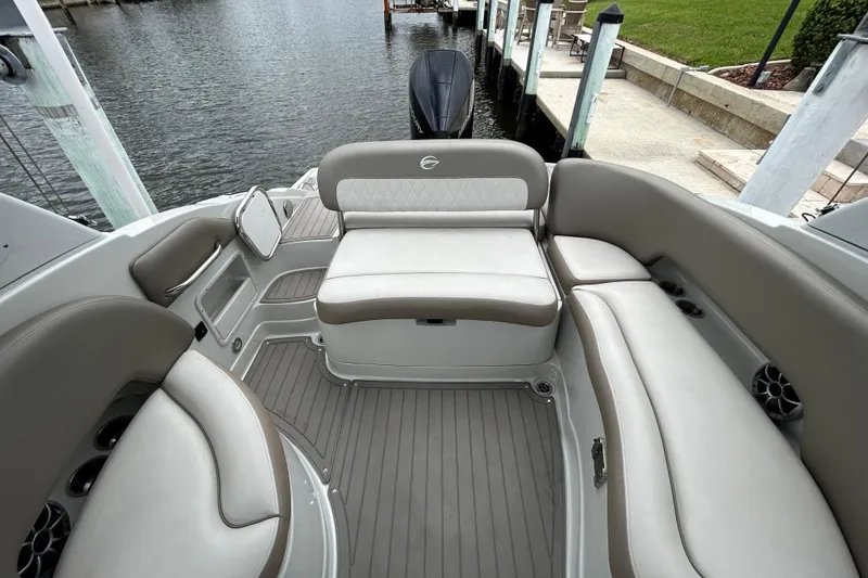 Slide: The Image of 2022 Crownline 270 XSS boat with sleek deck design and powerful outboard motor. - 46