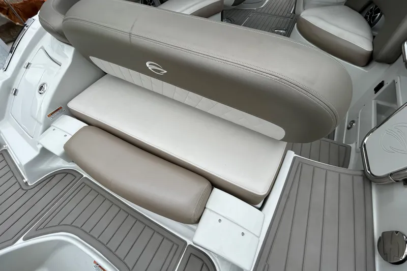Slide: The Image of 2022 Crownline 270 XSS boat interior with beige seating and sleek design. - 54