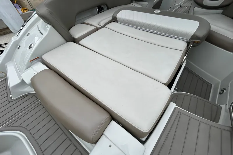 Slide: The Image of 2022 Crownline 270 XSS boat interior with cushioned seating and sleek design. - 55